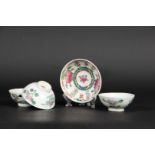 A set of three porcelain cups and saucers with floral decor. China, Tongzhi.