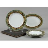 A lot of porcelain consisting of a dinner plate, soup plate, breakfast plate and serving bowl with G
