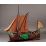 A ship model of a flat bottom with a deckhouse. Approx. 1900.