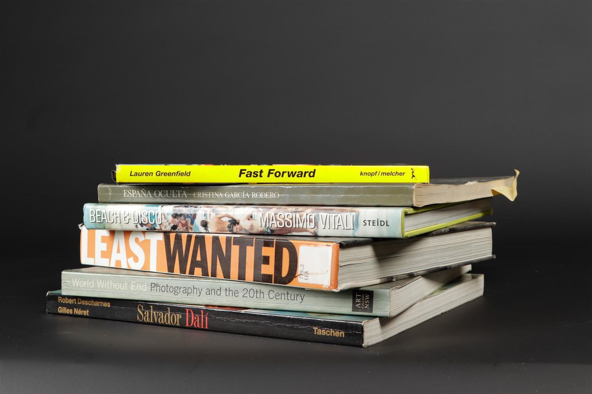 Collection of books including Least Wanted: A Century of American Mugshots, Mark Michaelson et al., 