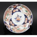 A porcelain Imari plate with bird of paradise decor. Japan, 18th century.