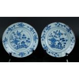 Two porcelain plates with floral decor in the outer rim. The center with bamboo, chrysanthemum and f