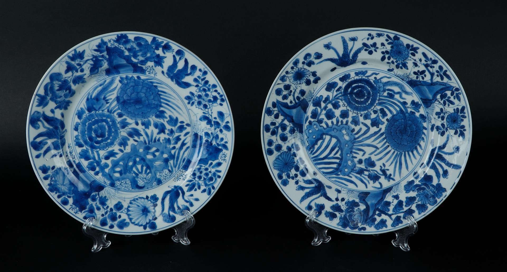 Two porcelain plates with decoration of chrysanthemums on rock decoration and floral outer rim, the 