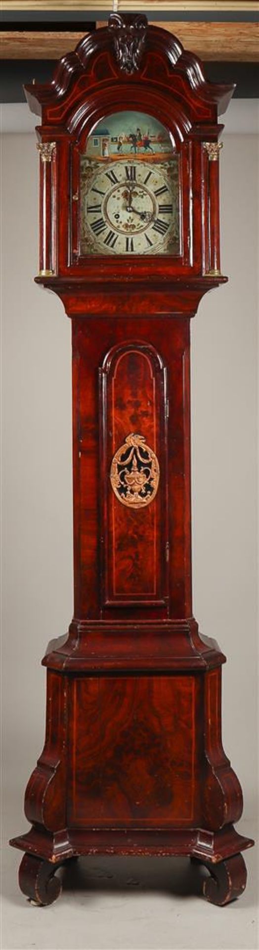 A "Frisian" longcase watch, ca. 1860. The case painted with wood structure (wooden). Two fama statue