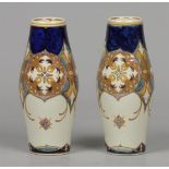 A set of polychrome painted earthenware vases, marked Rozenburgh model 368. The Netherlands, circa 1