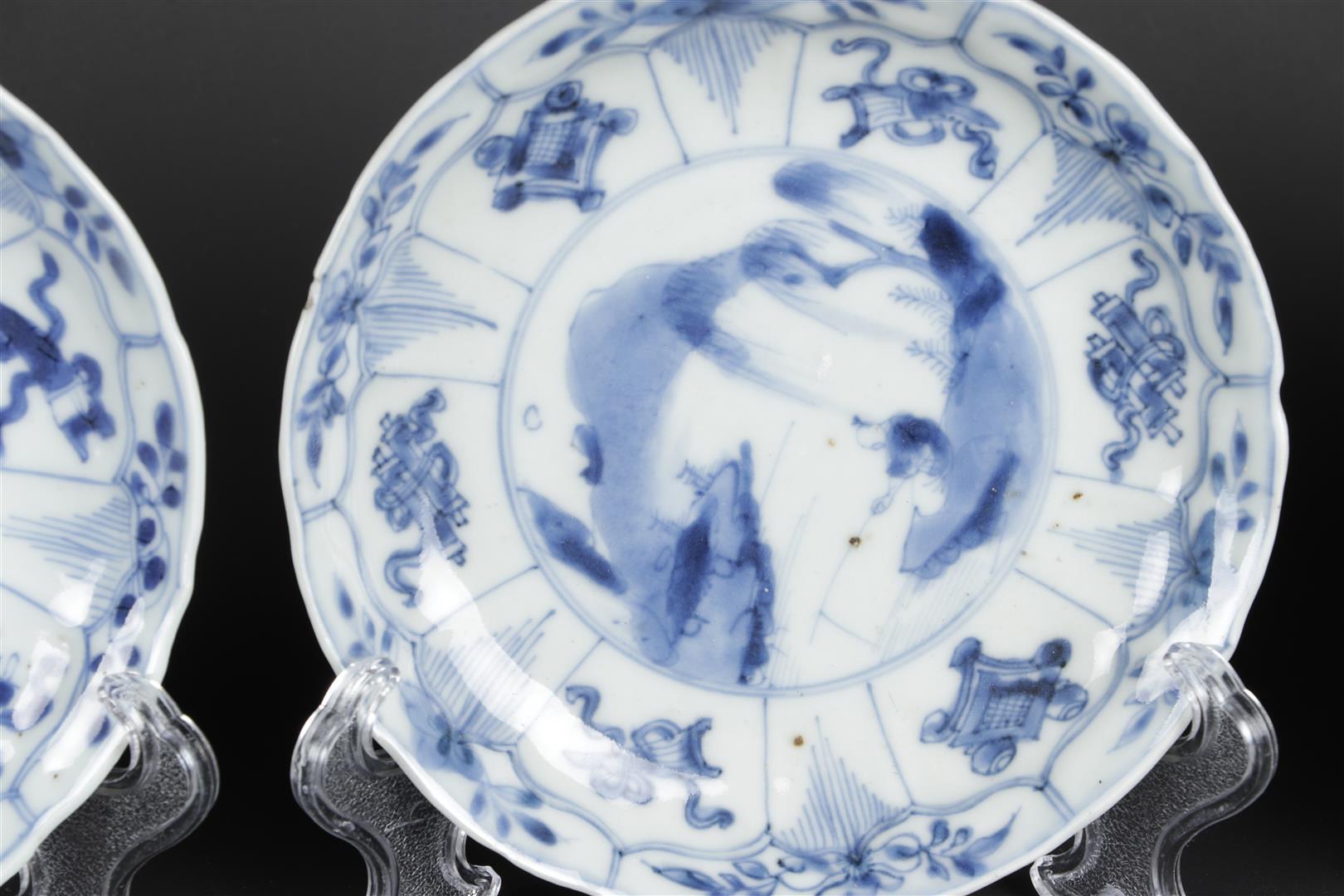 A set of three porcelain plates with landscape decor and floral decor in sections. China, Kangxi. - Image 2 of 4