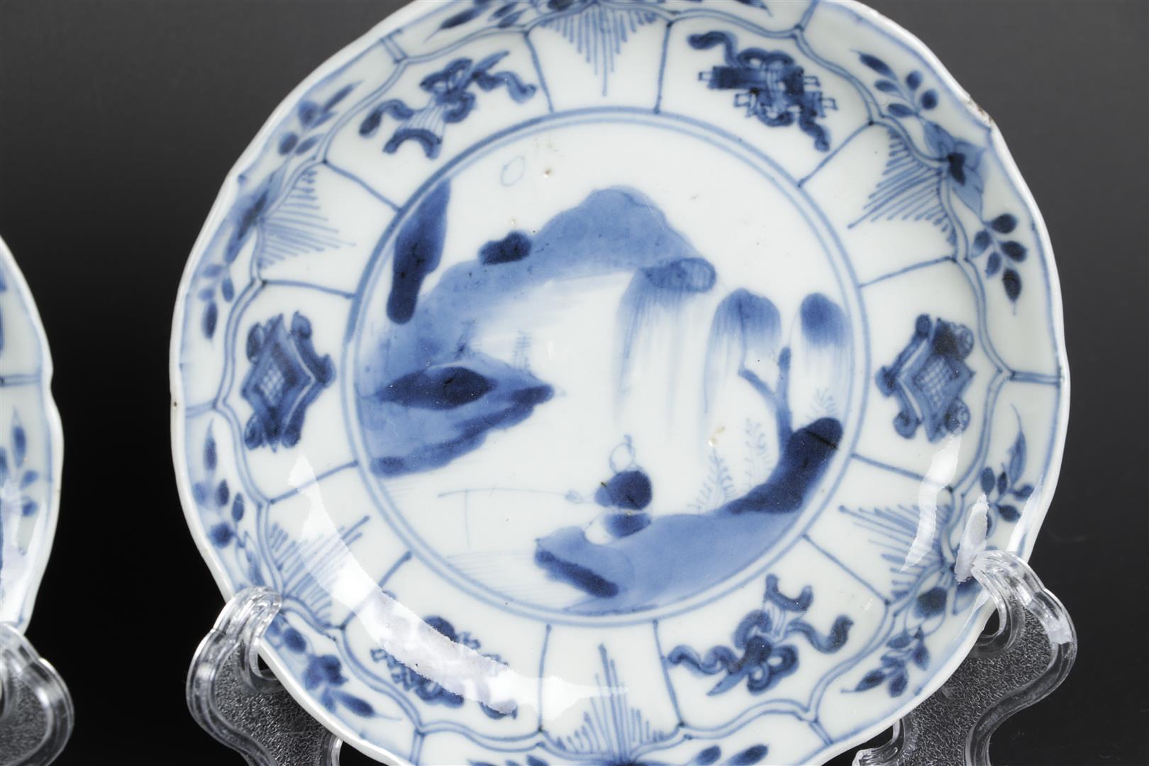 A set of three porcelain plates with landscape decor and floral decor in sections. China, Kangxi. - Image 3 of 4