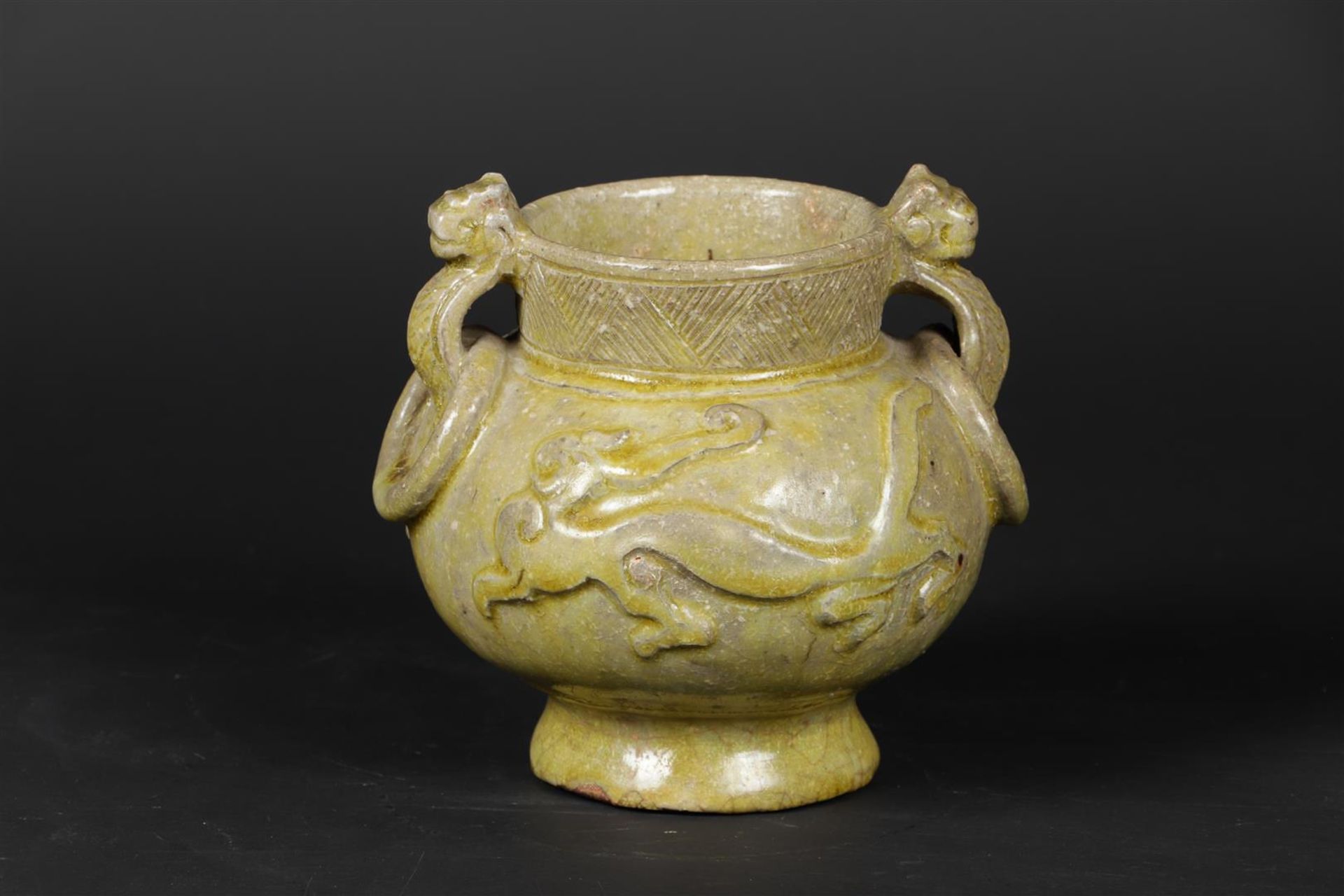 An earthenware censer decorated with dragons, after an antique example.