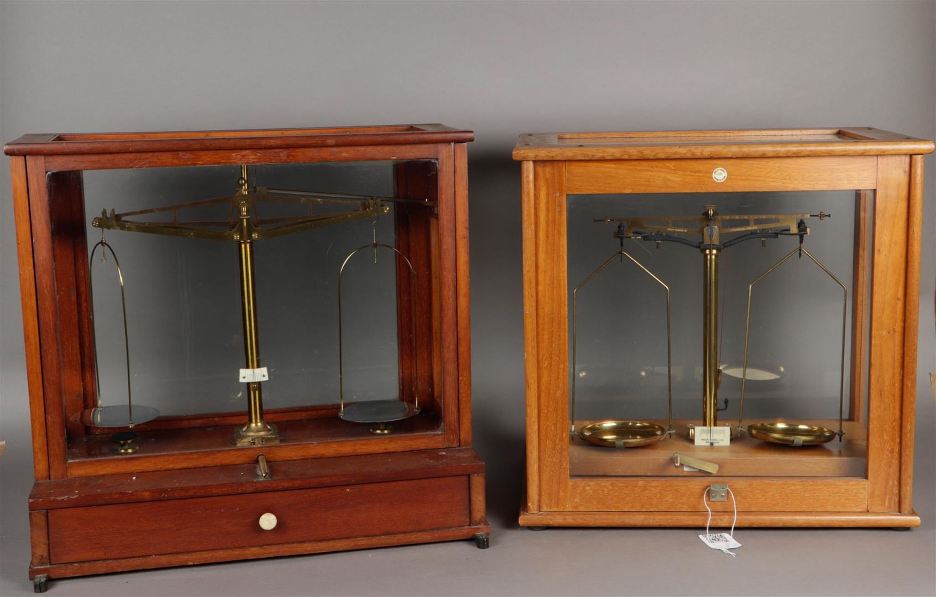 A lot consisting of two apothecary scales. 20th century.