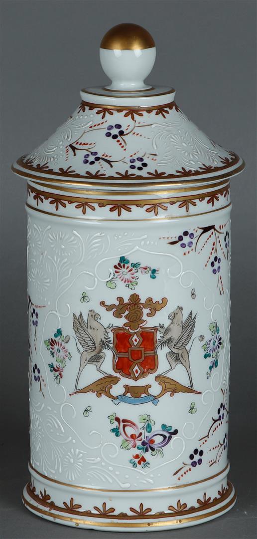 A large, partly gilded porcelain canister depicting griffins holding up a coat of arms, marked "Sams