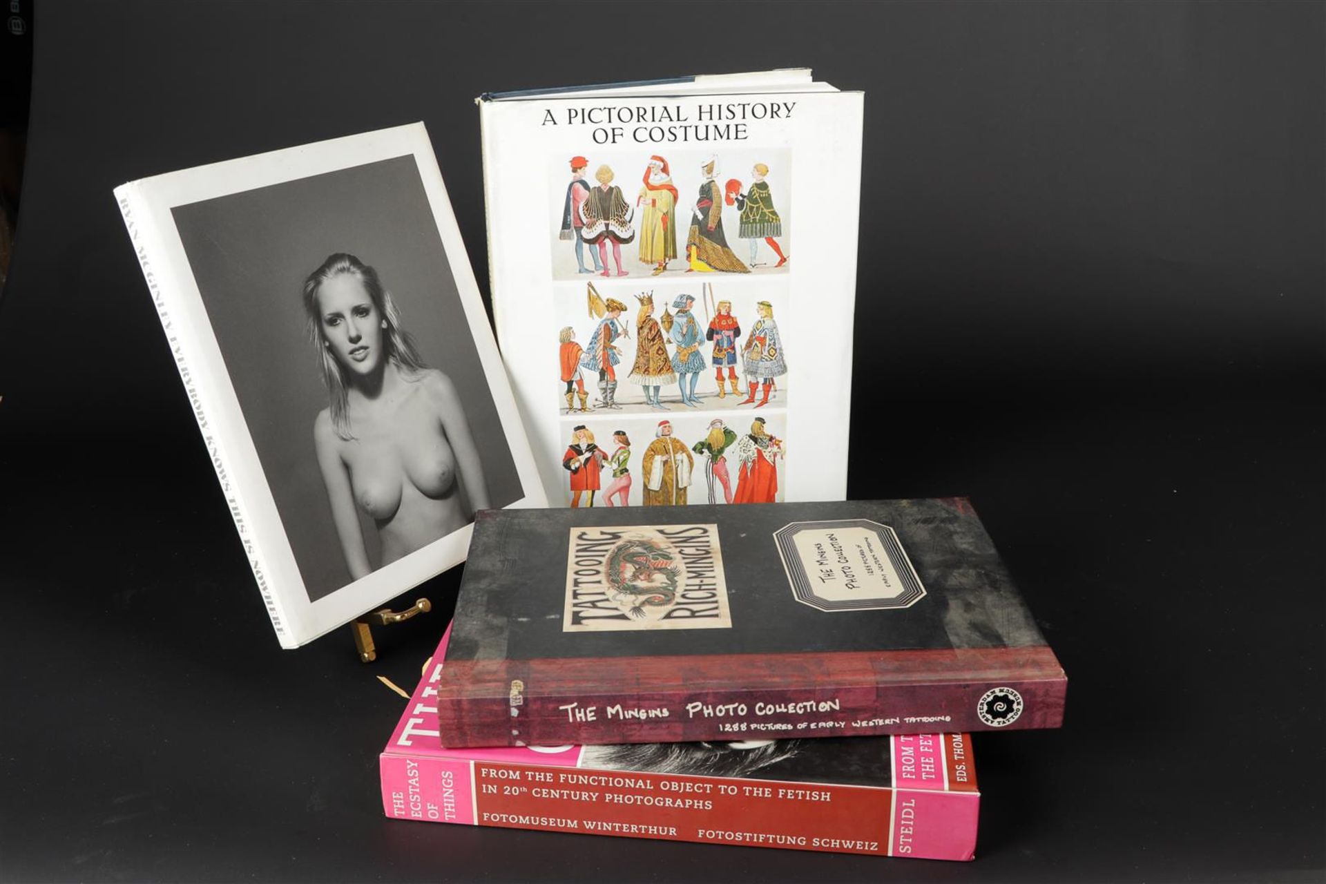 Collection of books including The Mingins Photo Collection: 1288 Pictures of Early Western Tattooing