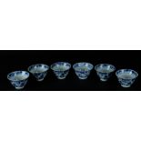 Six porcelain bowls with lotus leaf relief decoration, with rich floral decoration between which riv