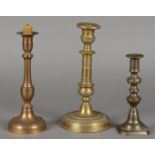 Three various, copper, French/English candlesticks, early 19th century.