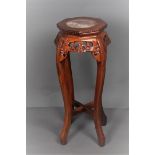 A carved wooden "Chinese" hocker/vase table.