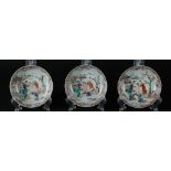 Three porcelain plates with Mandarin decoration of figures at a pavilion in a landscape. China, Qian