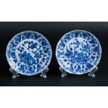 Two porcelain angled plates with relief lotus leaf, outer edge decor, the center with rich floral de