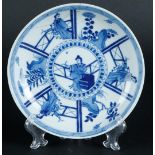 A porcelain dish with figures in divisions, marked on the back. China, Kangxi.