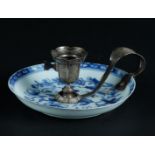 A porcelain saucer with floral decor. China, Qianlong. With silver candlestick mounts, 19th century.