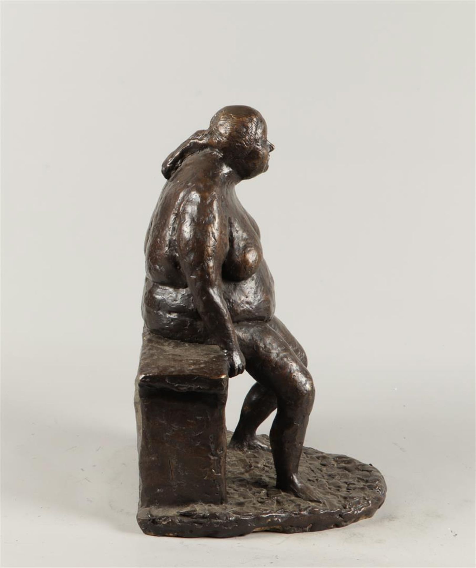 A dark patinated bronze statue of a voluptuous lady on a bench. 2nd half of the 20th century. - Image 2 of 3