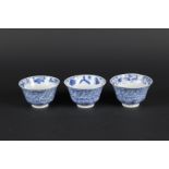 Three porcelain bowls with carp and perch decor, exterior with rich floral decoration. China, 18th/1