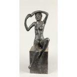 A bronze sculpture of a seated naked lady, on a marble bust. 2nd half of the 20th century.