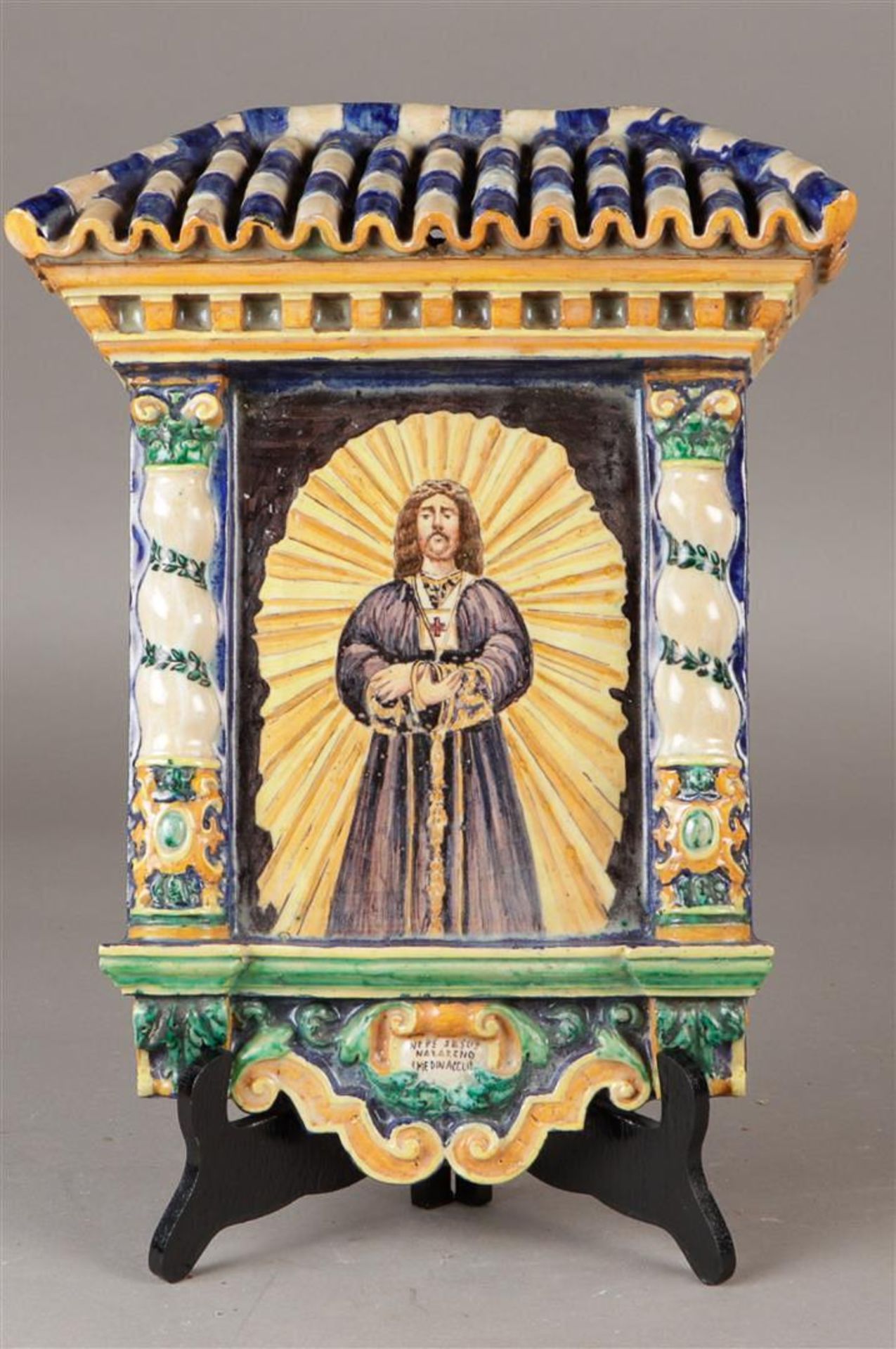 A glazed earthenware applique depicting "Nuestro Padre Jesus Nazareno de Medinaceli" (Jesus before P