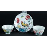 Two Famille Rose porcelain bowls with Phoenix decor and floral decor and a plate with rooster decor.