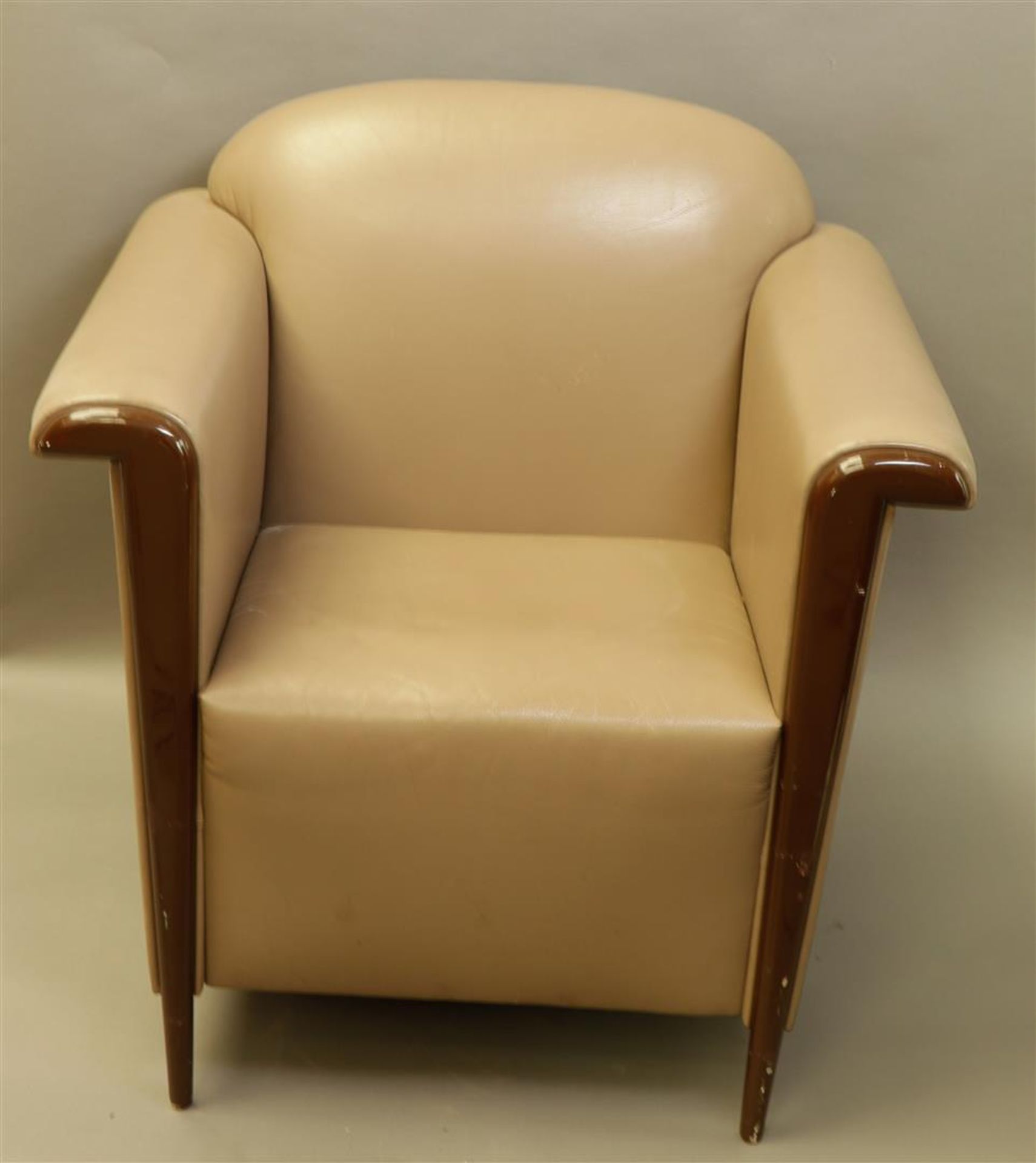 A mahogany and faux leather club armchair in Art Deco style. 20th century.