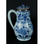 A large porcelain jug with peony decoration, around which rich floral decoration. With silver neck r