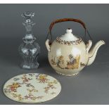 A lot consisting of an earthenware English teapot, with a cut glass decanter.