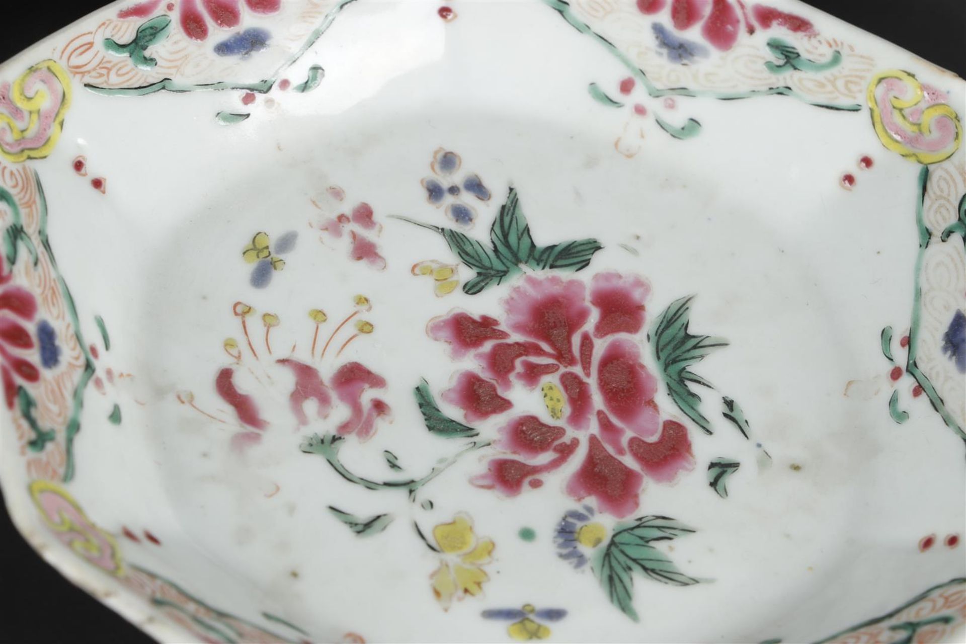 Three porcelain angled Famille Rose plates with rich floral decoration. China, Yongzheng/Qianlong. - Image 4 of 6