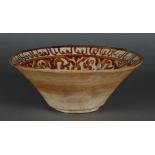 An earthenware nishapur bowl with floral decoration and decorated with a figure in the center. Persi