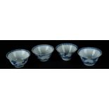 Four porcelain bowls with cloud (rui) decor on the outside, above which lotus, prunis and flower dec