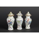 Three porcelain Famille Rose lidded jars with mountain landscape decoration. China, Qianlong.