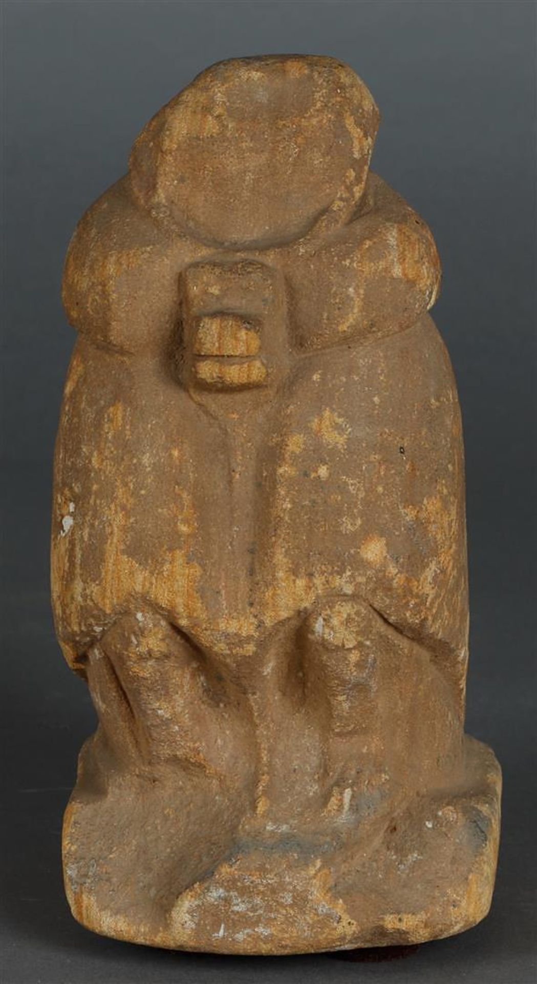 An archaic stone statuette of a baboon (God of wisdom), Egypt (?).