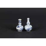 Two porcelain small model knob vases with floral decor and a butterfly. China, Yongzheng.