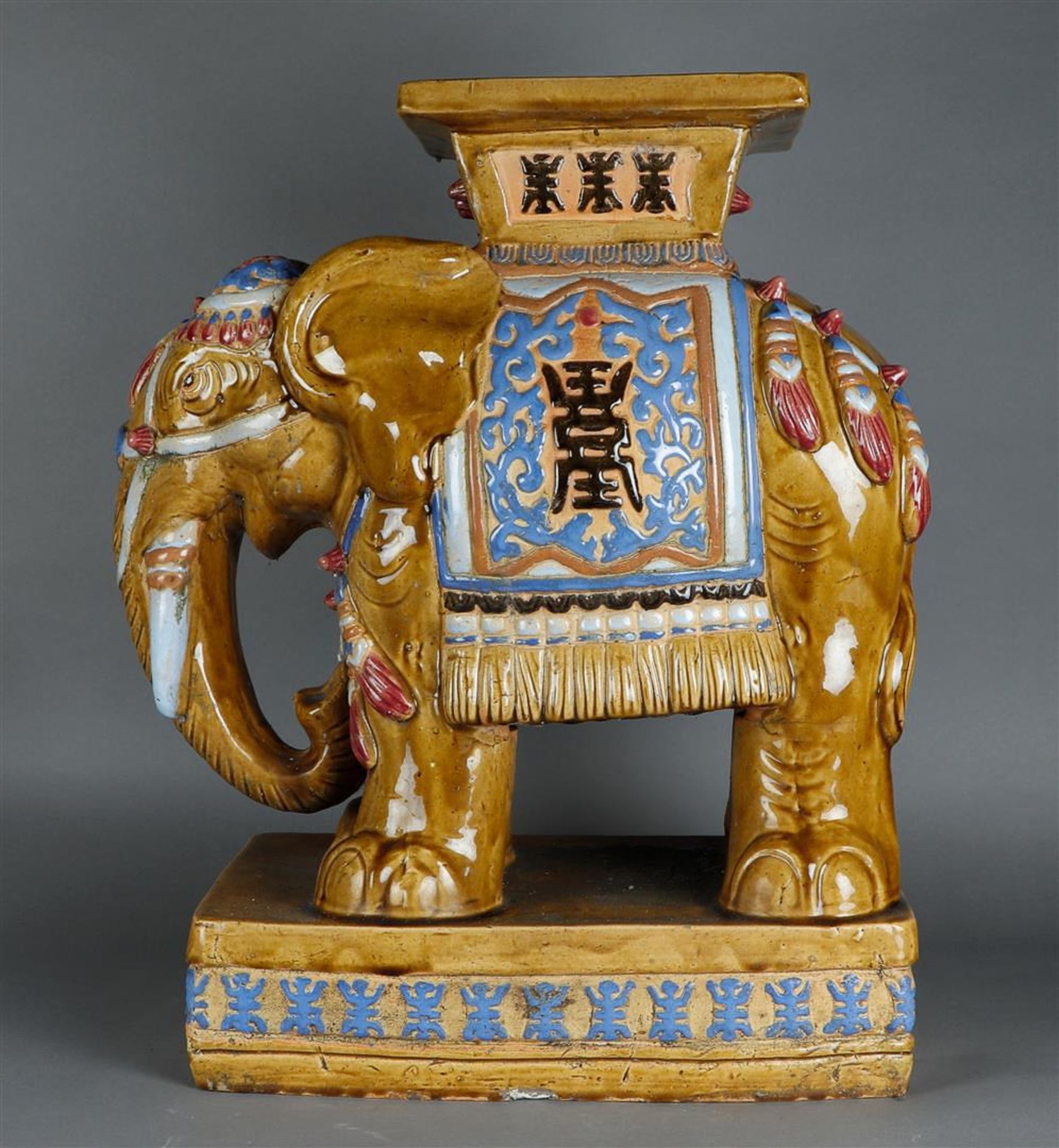 An earthenware "Chinese", garden ornament/hocker in the shape of an elephant, 20th C.