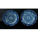Two porcelain dishes with lotus leaf decor with floral decor, a lotus in the center. Kangxi/Yongzhen