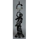 A composite metal table lamp depicting the personification of spring.