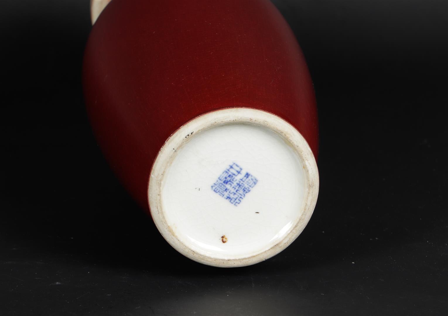 A porcelain Sang de boeuf vase, marked on the bottom. China, 20th century. - Image 2 of 2