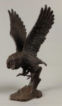 A bronze sculpture of an attacking little owl. Second half of the 20th century.