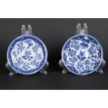 Two porcelain plates with lotus flower decor, filled with pine, bamboo and chrysanthemum decor. The 