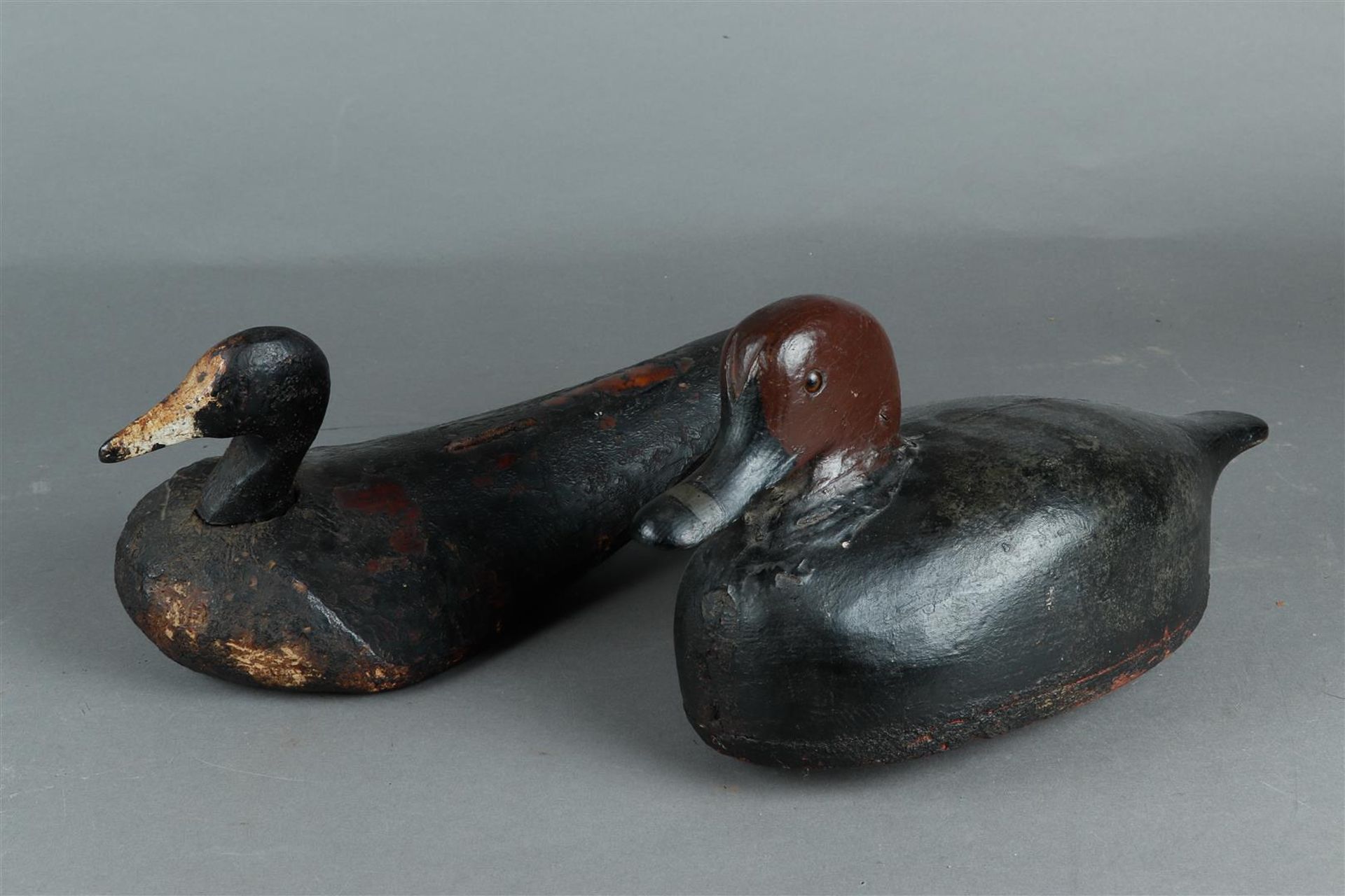 A lot consisting of (2) antique decoys, with weight.