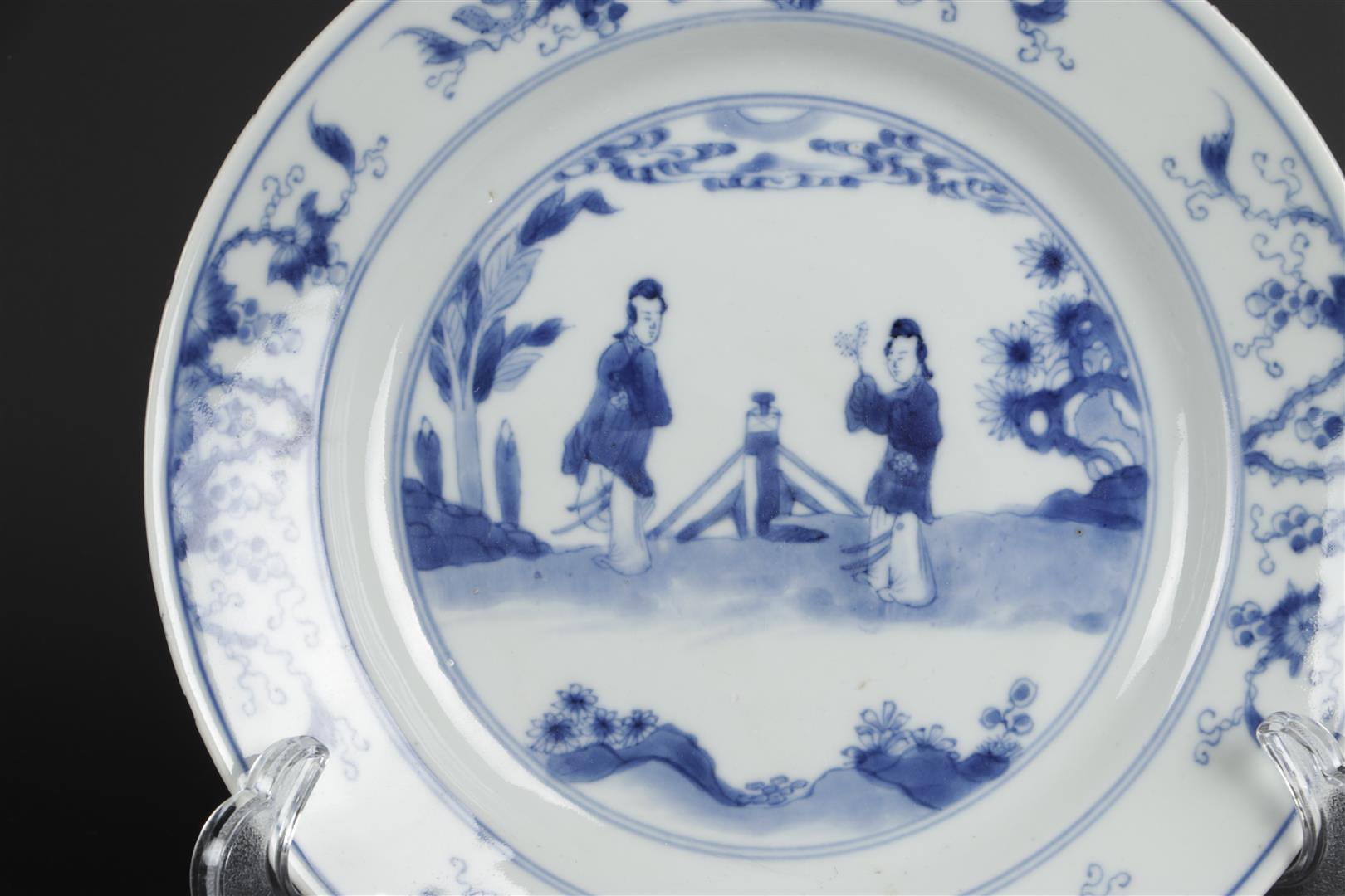 A porcelain plate with decoration in the center of two standing long lines in landscape with fence d - Image 3 of 3