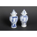 Two porcelain lidded vases with a so-called grape-on-vine decor. China, Qianlong.