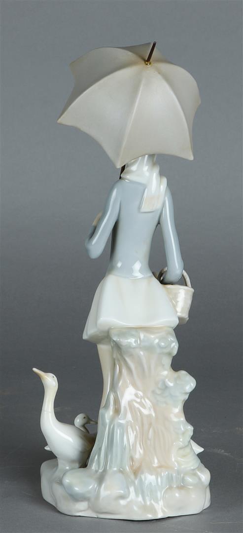 A porcelain figure in the shape of a lady with umbrella and geese, marked Lladro. Spain, 20th centur - Image 2 of 3