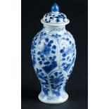 A porcelain lidded vase with lotus leaf divisions with floral decor, marked with artemisia leaf. Chi