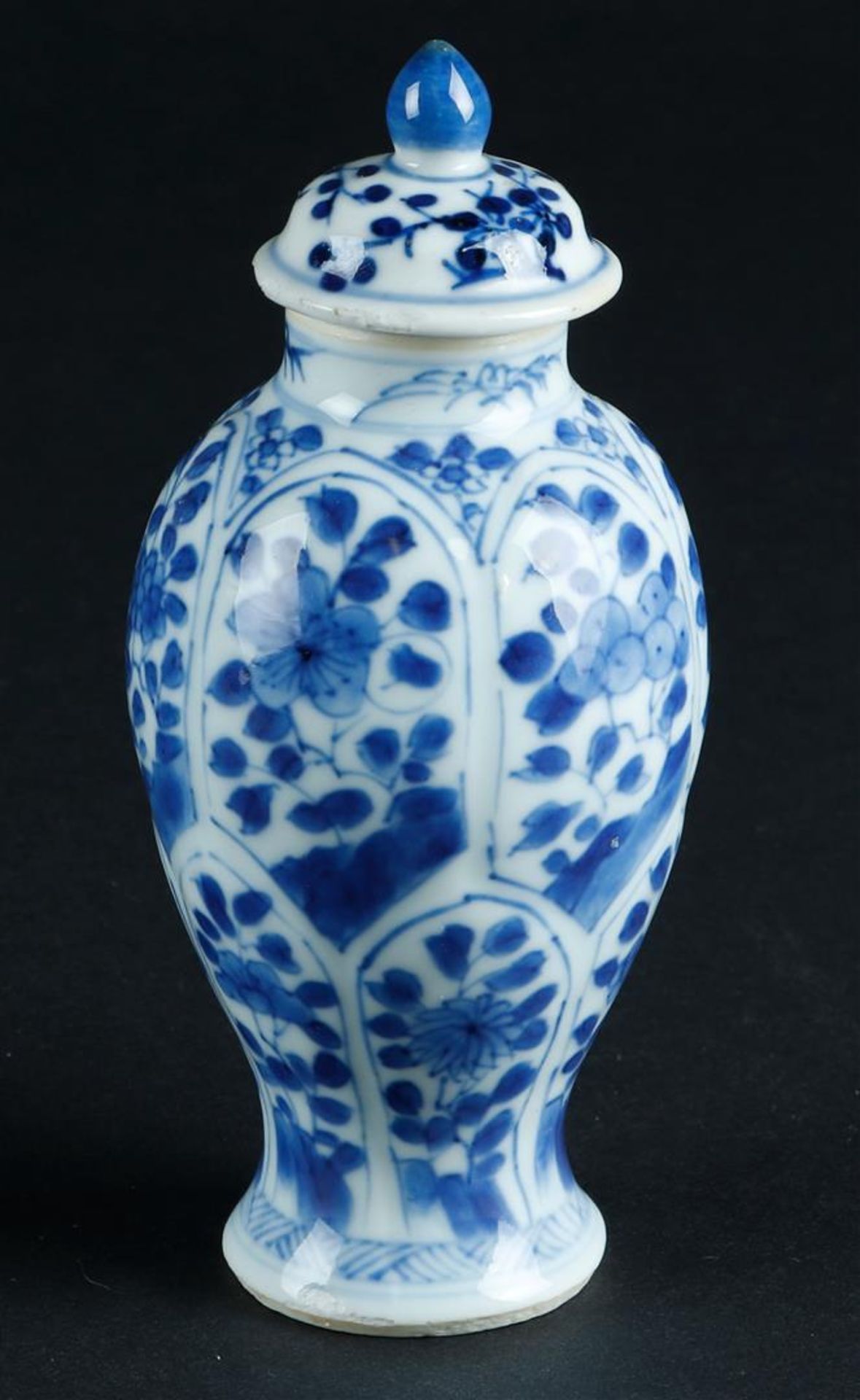 A porcelain lidded vase with lotus leaf divisions with floral decor, marked with artemisia leaf. Chi