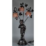 A three-light table lamp with glass roses and an image of a young girl picking flowers. Signed "Vila