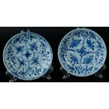 Two porcelain plates with lotus flower divisions with floral decor. China, Kangxi.